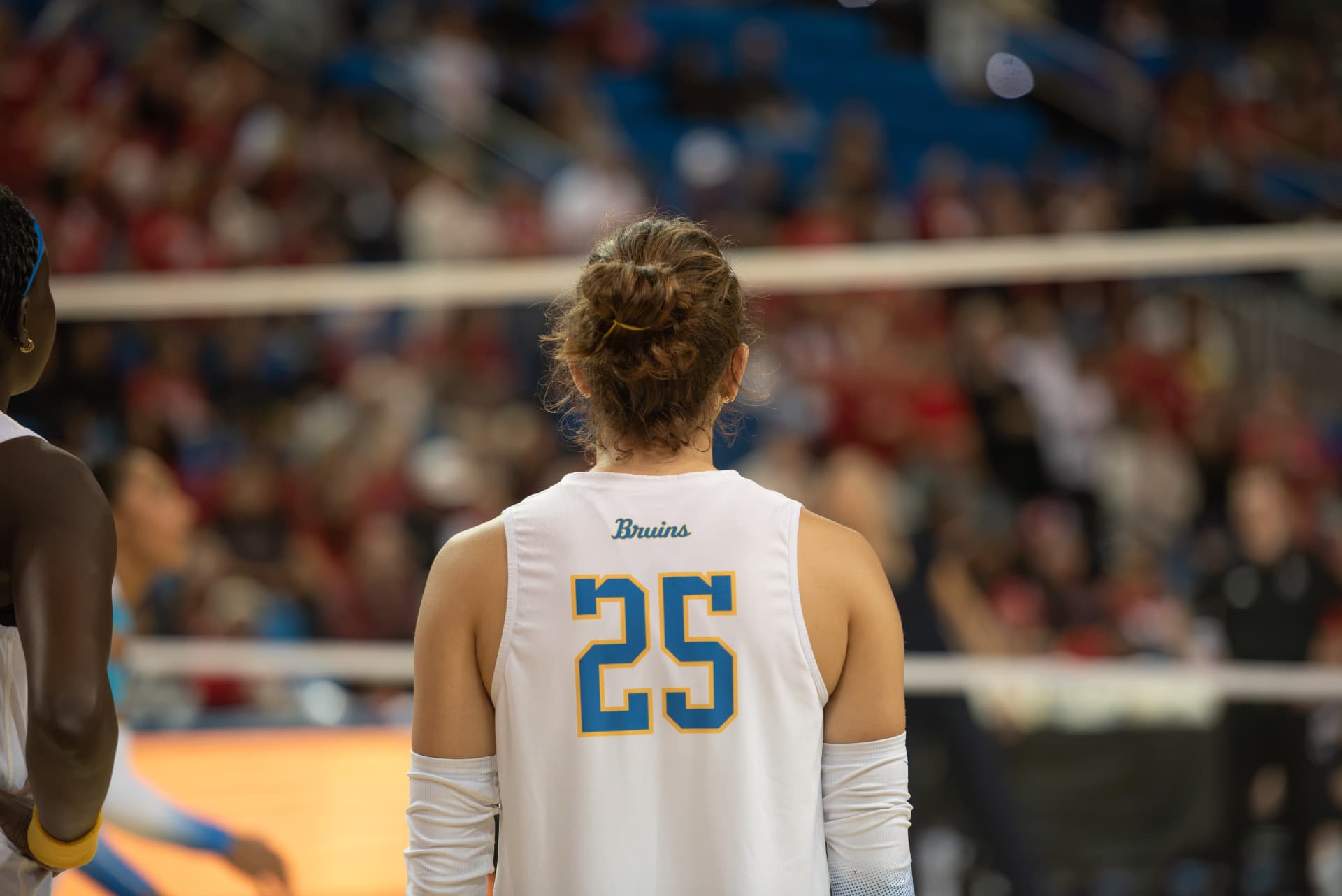 UCLA volleyball player number 25 from behind