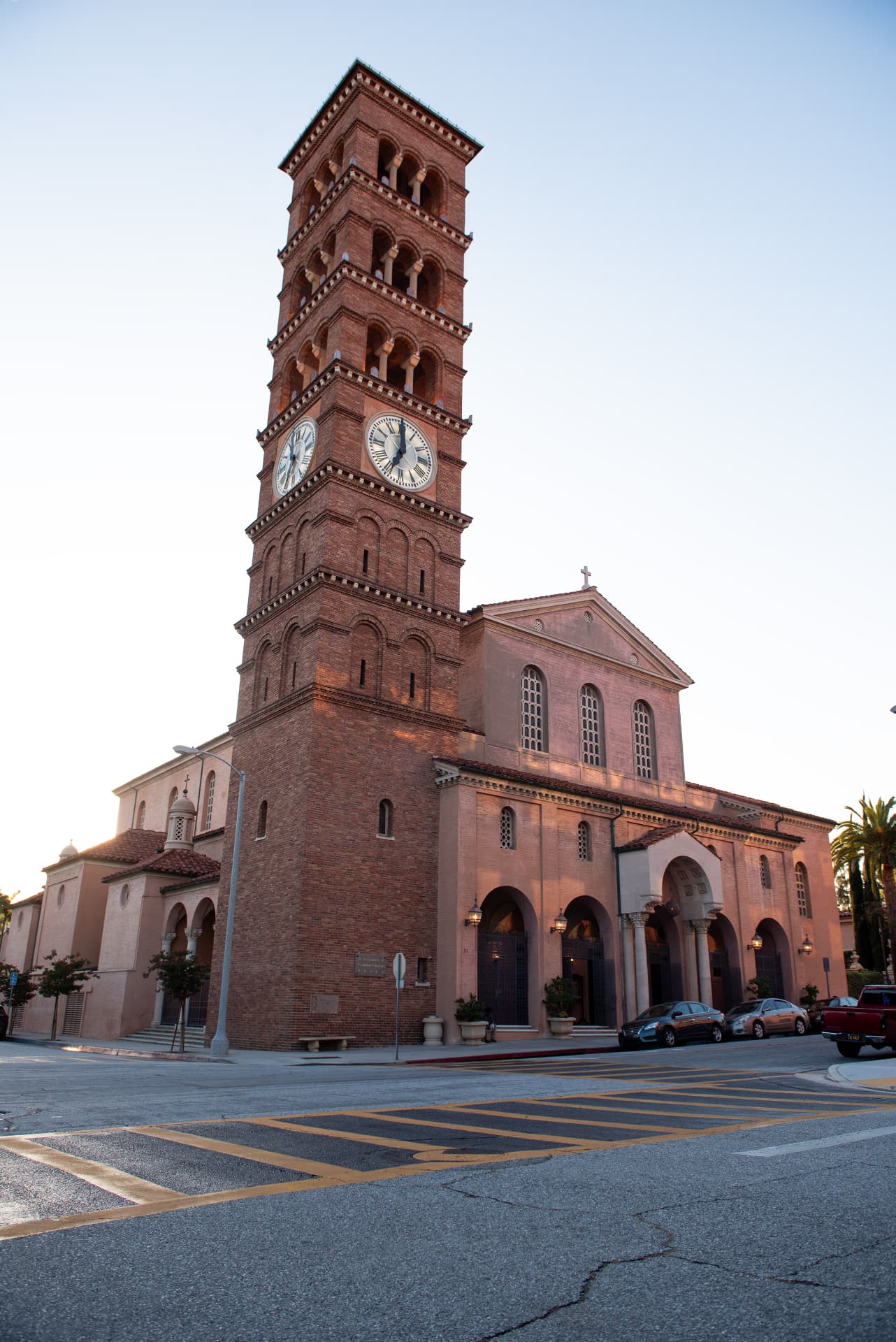 Brick clock tower church at dusk