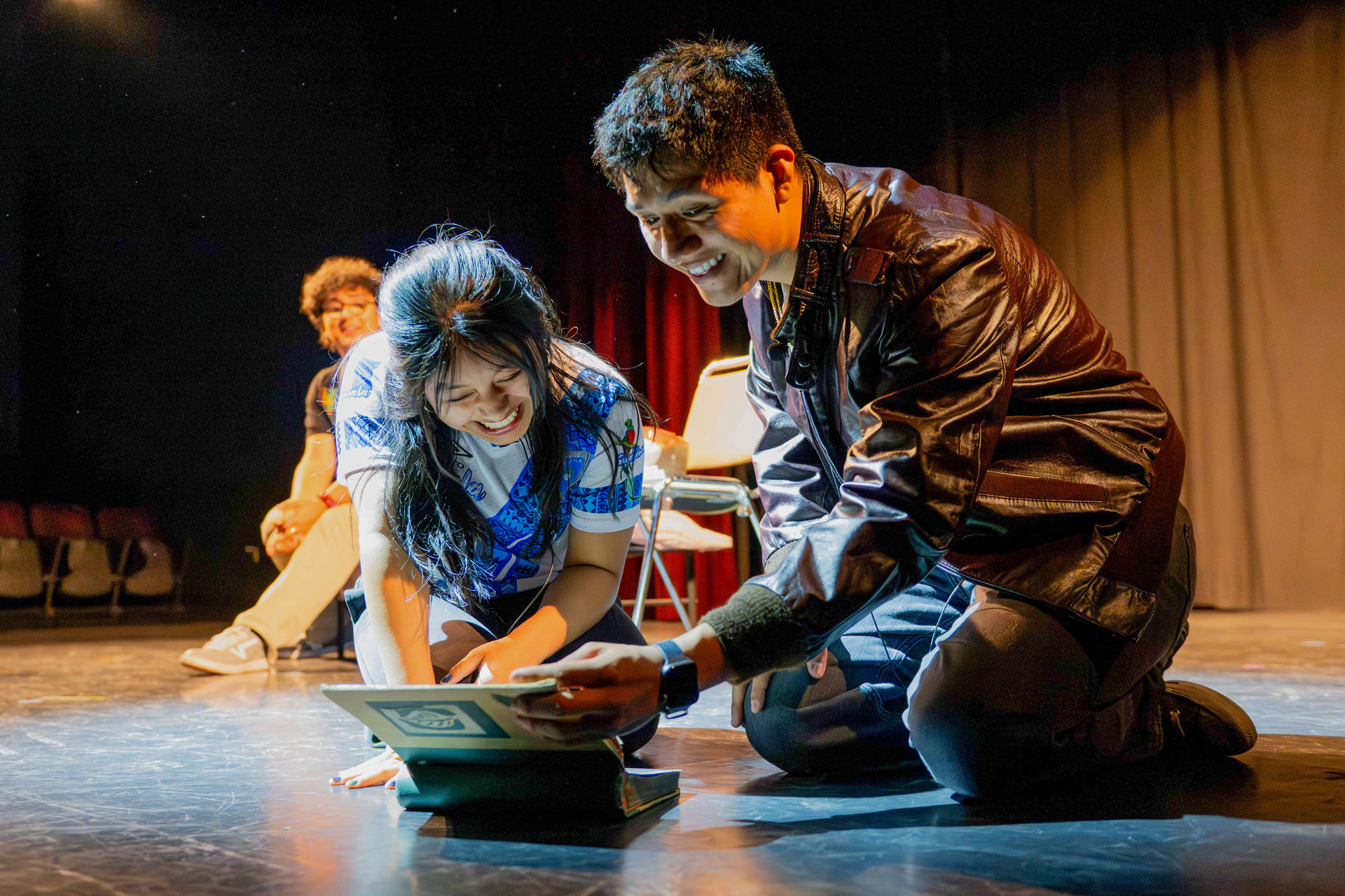 Two actors sharing a scene on stage